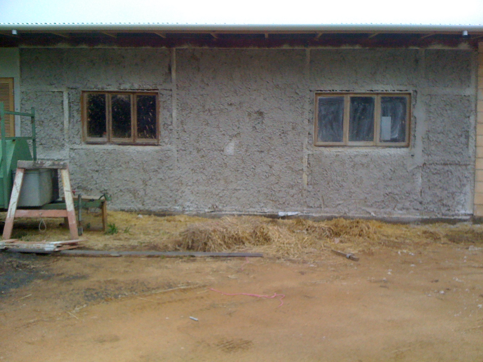 First coat of render at rear